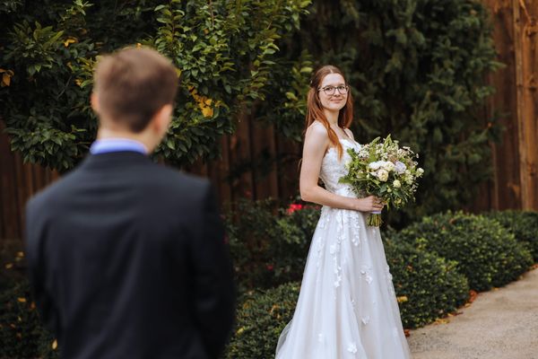 Brian sees Anastasia standing in the garden.