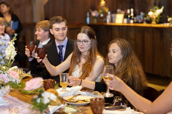 Laughter around the table as guests enjoy the evening.