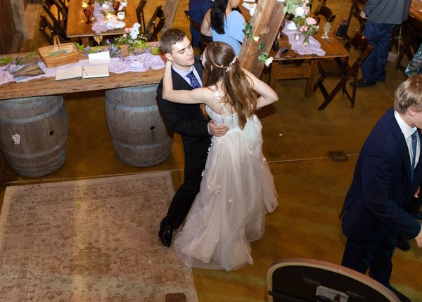 The newlyweds share one more dance as the night winds down.